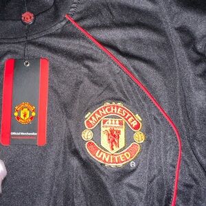 Manchester United xxl shirts new in the package. Black and red